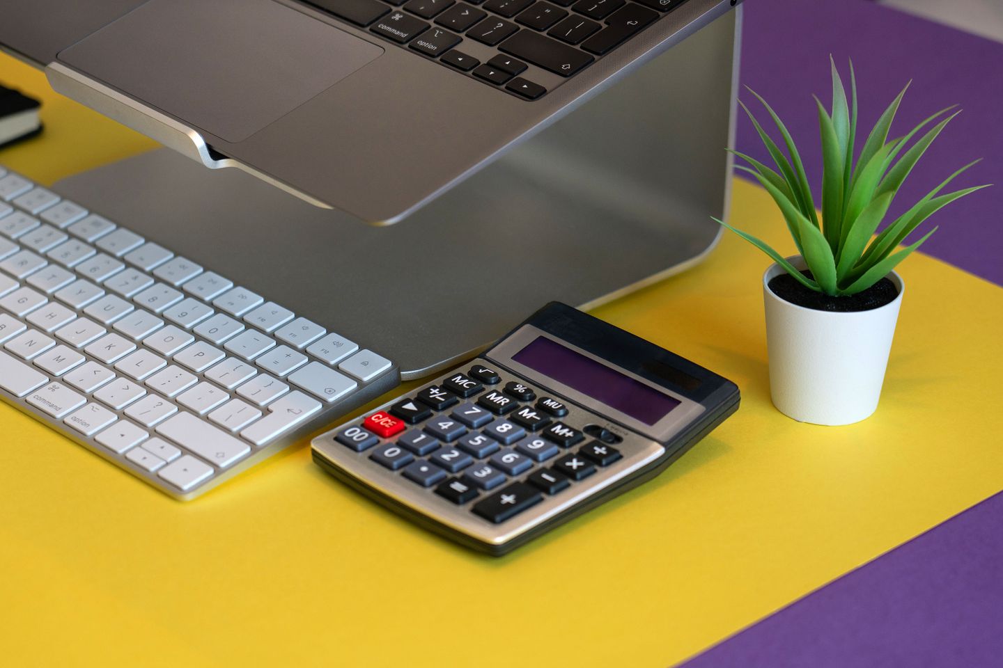 Desk with a computer and calculator